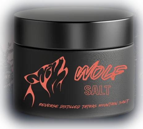 A matte black jar of Wolf Salt with a coral howling wolf on the label